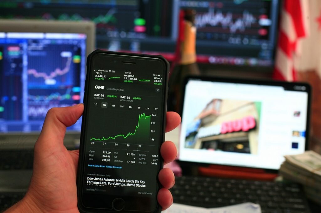 A visual of dividend stock charts on a trader smartphone - best ways to make passive income