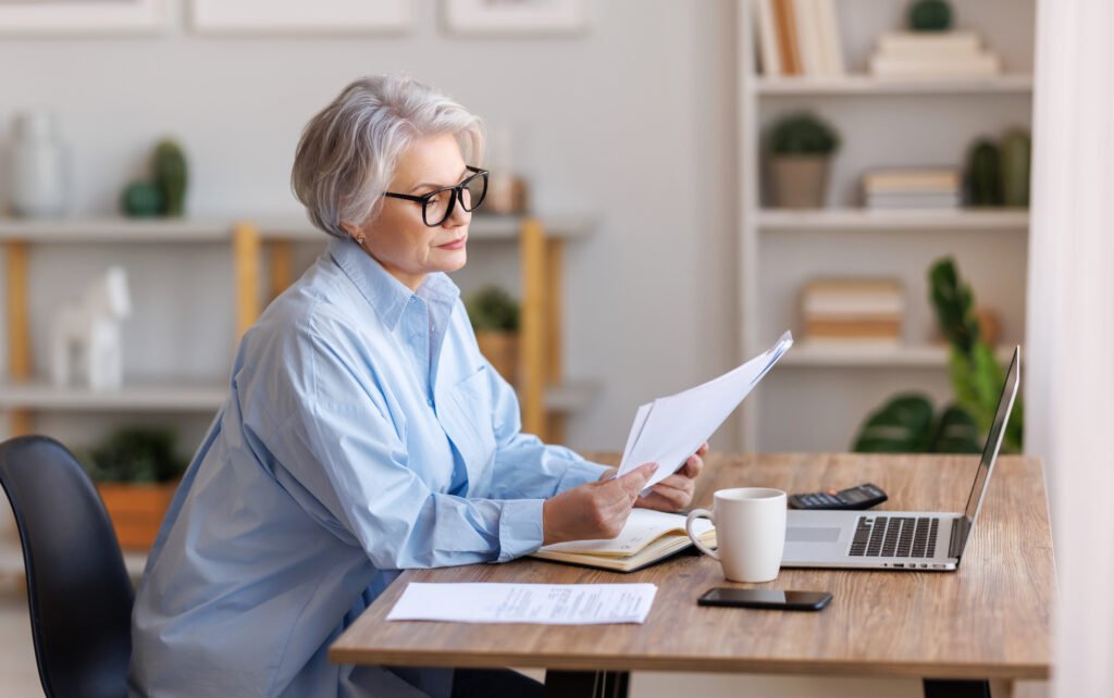 A virtual assistant working on a laptop at a tidy desk - entry level remote jobs