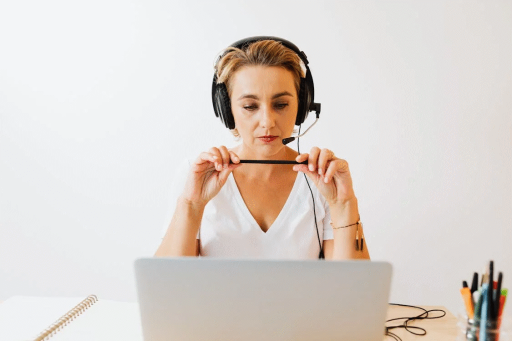 A person working from home with a headset and laptop - remote customer service jobs
